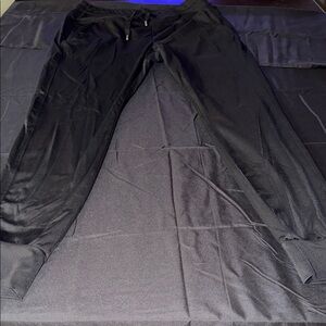 Women’s black Halara leggings with drawstring and pockets. Super comfortable.